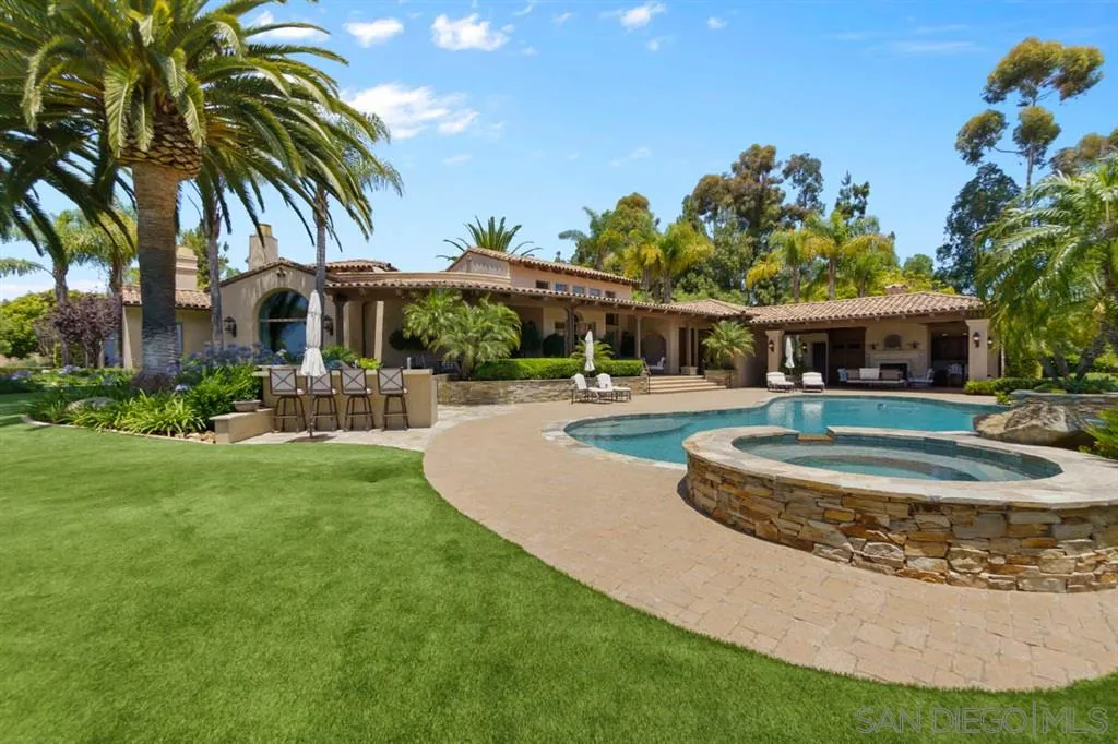 Encinitas, CA 92024 - Photo 5 of 25 a view of a house with swimming pool and a yard
