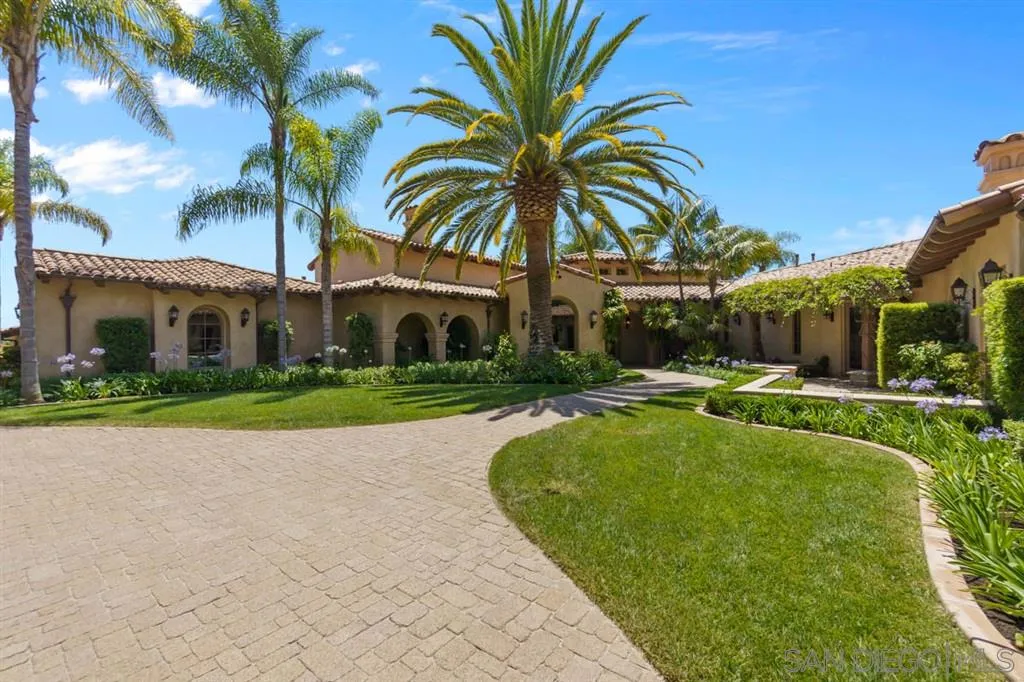 Encinitas, CA 92024 - Photo 7 of 25 a view of swimming pool that has lawn chairs with plants and palm trees