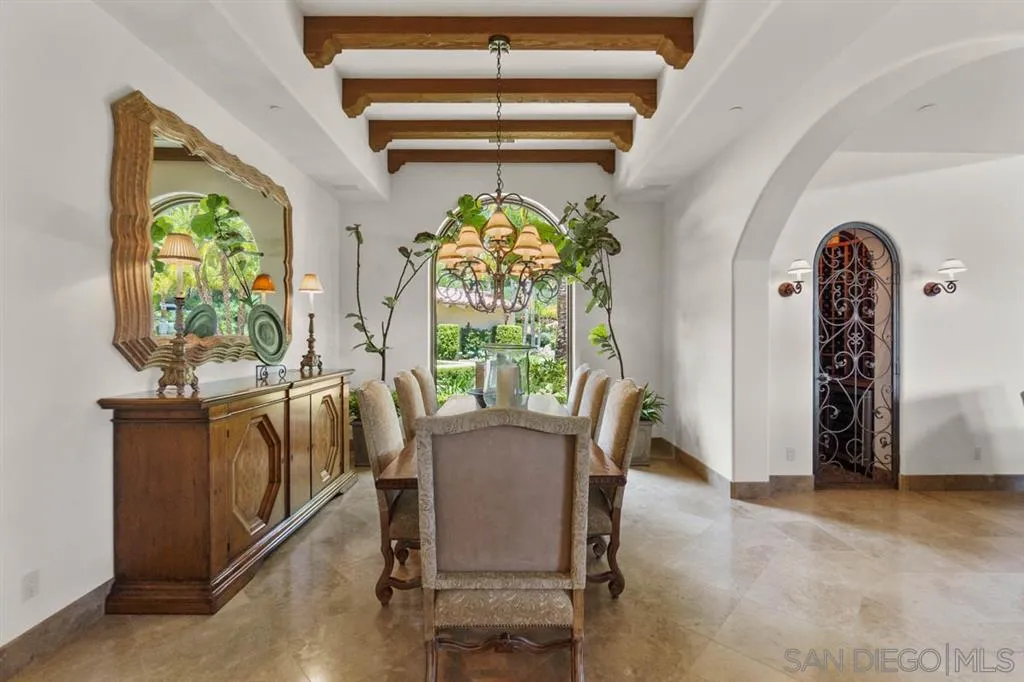 Encinitas, CA 92024 - Photo 9 of 25 a view of a dining room with furniture a chandelier and wooden floor