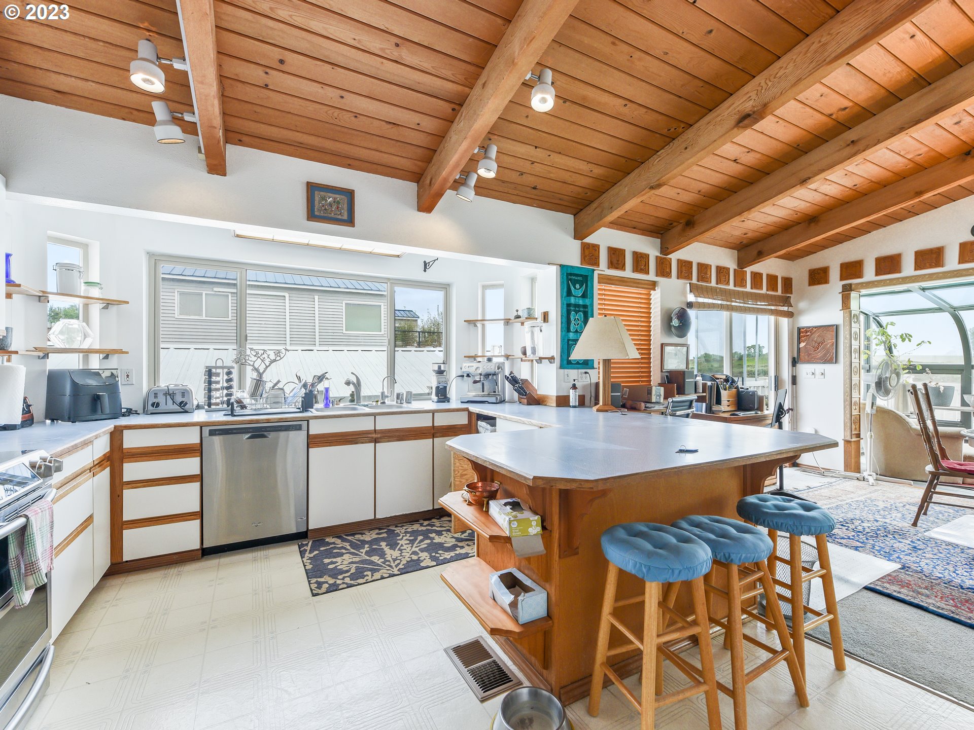 23586 Northwest St Helens Road, Unit M34 Portland, OR 97231 - Photo 8 of 20 a large kitchen with lots of counter and chairs