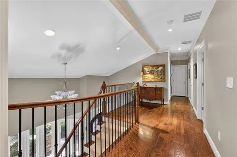 a dining room with furniture and a chandelier