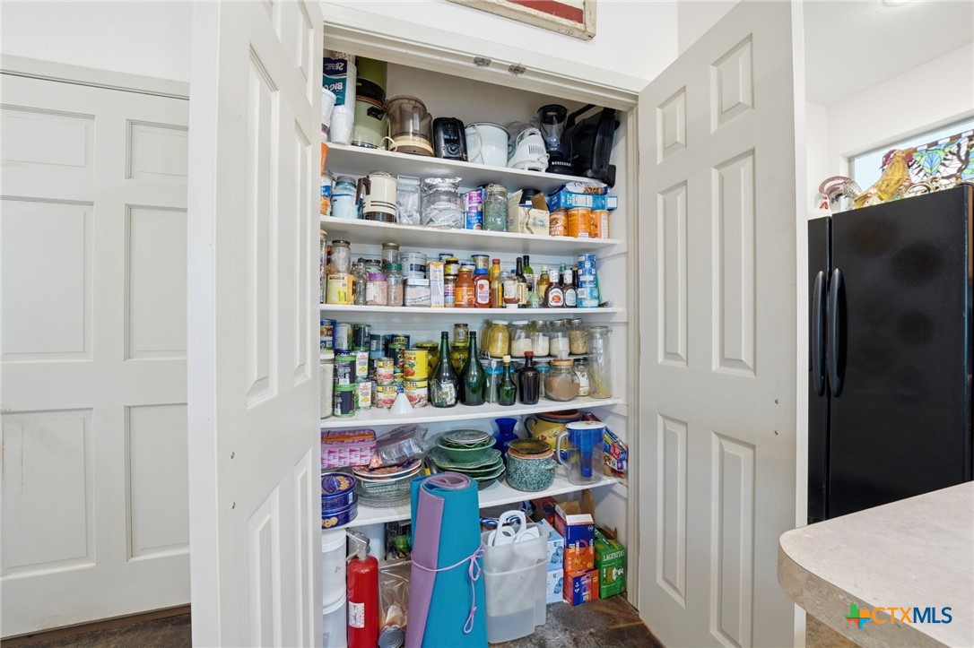 3075 Rustler Canyon Lake, TX 78133 - Photo 12 of 48 a view of storage and utility room with fridge and closet