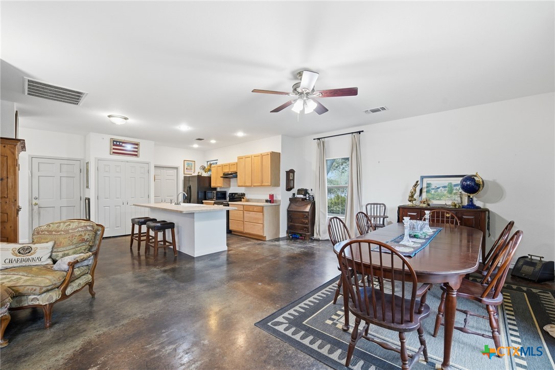 3075 Rustler Canyon Lake, TX 78133 - Photo 15 of 48 a view of a dining room with furniture and a chandelier
