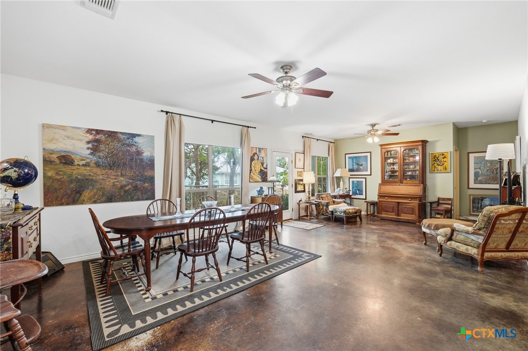 3075 Rustler Canyon Lake, TX 78133 - Photo 17 of 48 a view of a dining room with furniture window and outside view