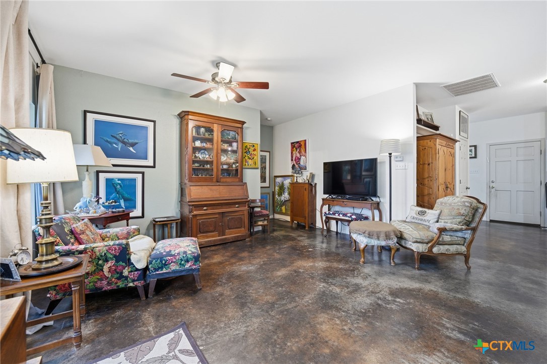 3075 Rustler Canyon Lake, TX 78133 - Photo 20 of 48 a living room with furniture and a flat screen tv