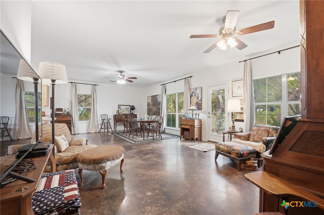 3075 Rustler Canyon Lake, TX 78133 - Photo 21 of 48 a living room with furniture and a large window