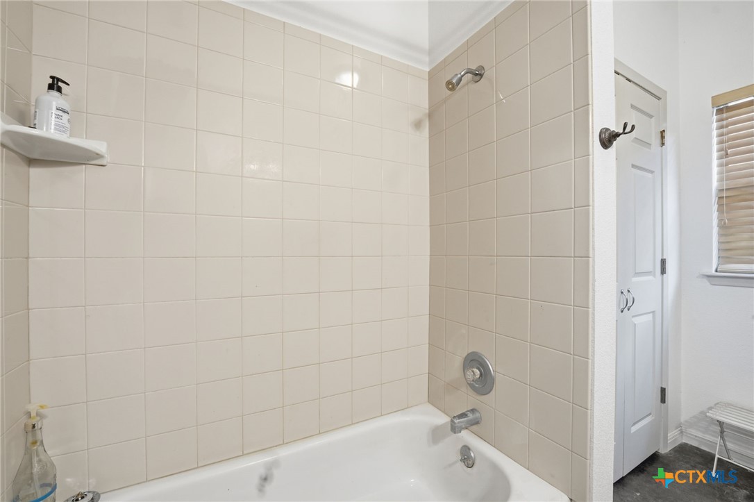 3075 Rustler Canyon Lake, TX 78133 - Photo 33 of 48 a bathroom with a bathtub and a shower
