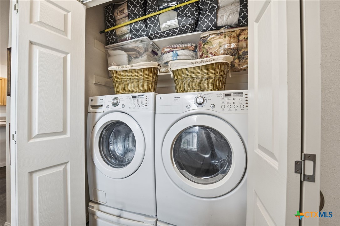 3075 Rustler Canyon Lake, TX 78133 - Photo 36 of 48 a utility room with dryer and washer