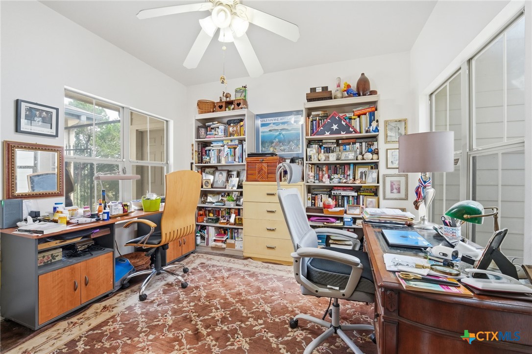 3075 Rustler Canyon Lake, TX 78133 - Photo 39 of 48 a view of a workspace with furniture and a window