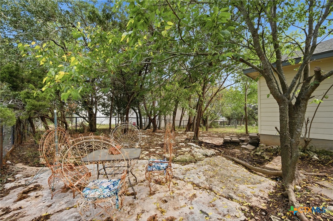 3075 Rustler Canyon Lake, TX 78133 - Photo 42 of 48 a view of a yard with large trees