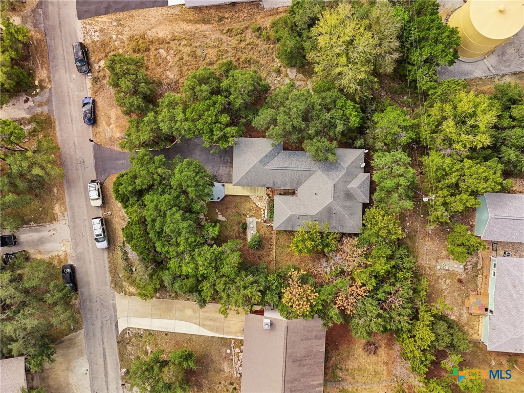 3075 Rustler Canyon Lake, TX 78133 - Photo 46 of 48 an aerial view of a house with yard swimming pool and outdoor seating