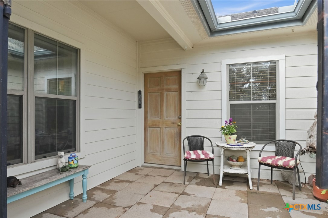 3075 Rustler Canyon Lake, TX 78133 - Photo 5 of 48 a backyard of a house with outdoor seating