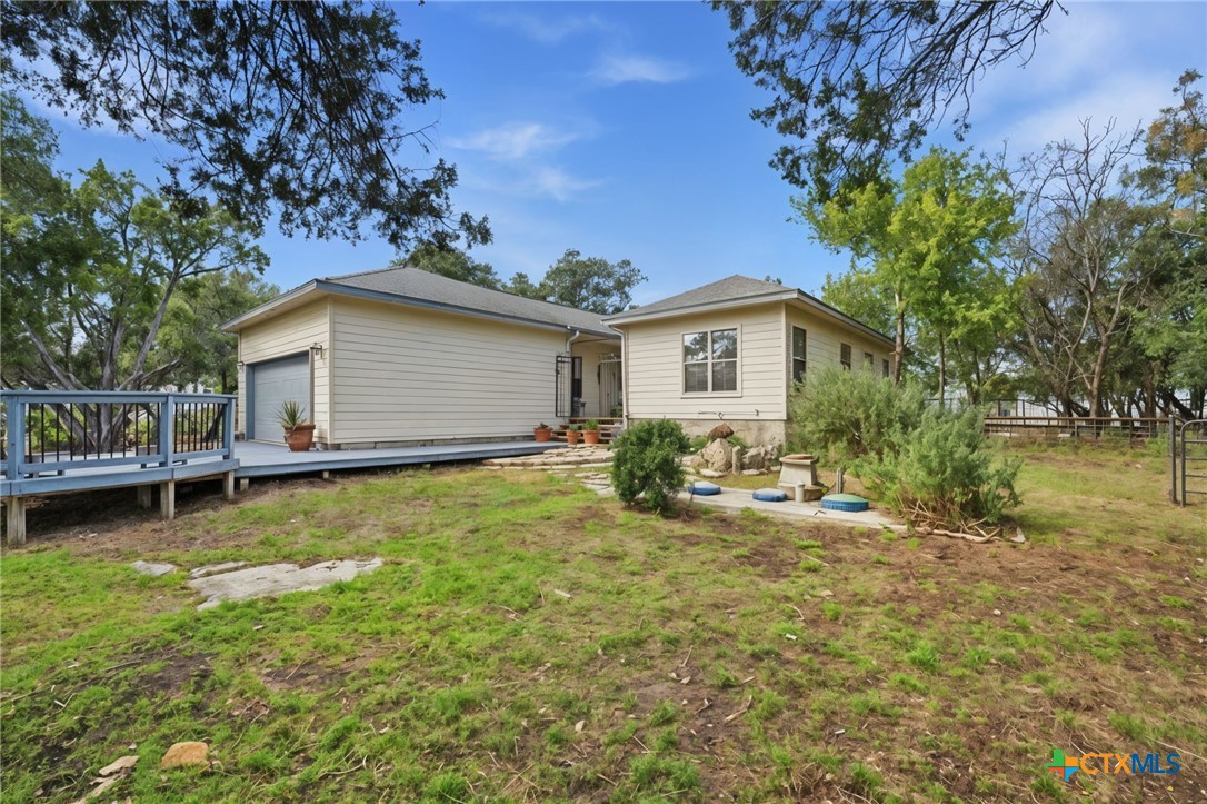 3075 Rustler Canyon Lake, TX 78133 - Photo 7 of 48 a view of a house with a yard and sitting area