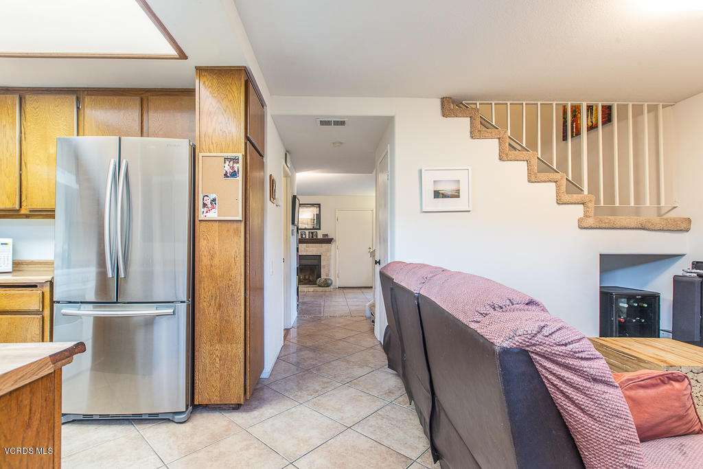 5149 Perkins Road Oxnard, CA 93033 - Photo 23 of 40 a kitchen with stainless steel appliances granite countertop a refrigerator and a stove top oven