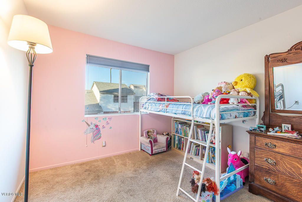 5149 Perkins Road Oxnard, CA 93033 - Photo 29 of 40 a bedroom with furniture and a baby crib