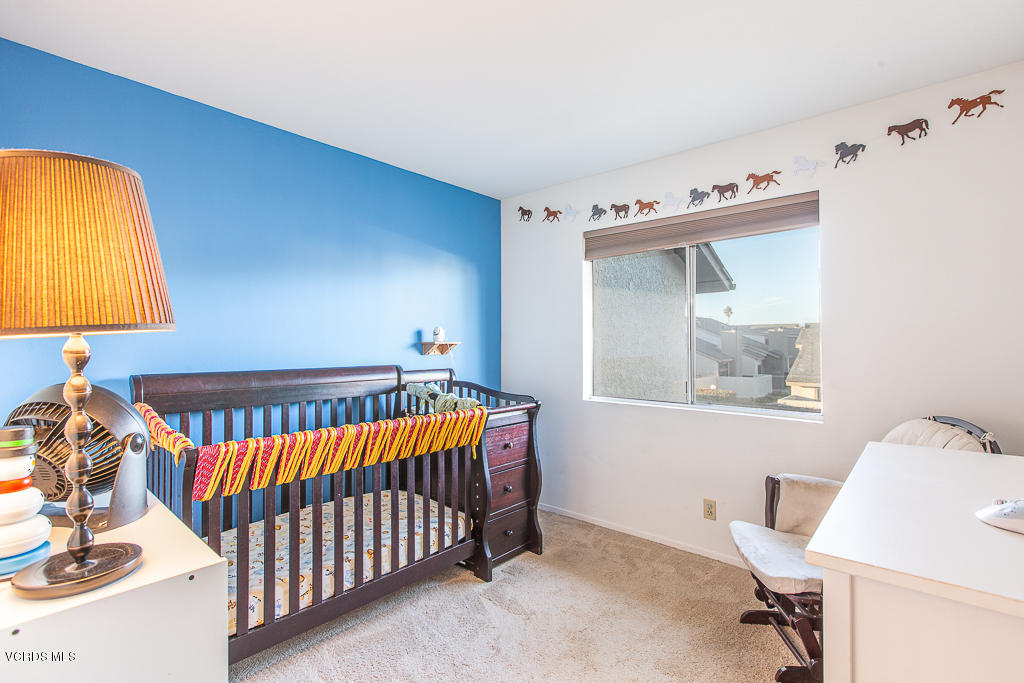 5149 Perkins Road Oxnard, CA 93033 - Photo 31 of 40 a bedroom with a bed and a window