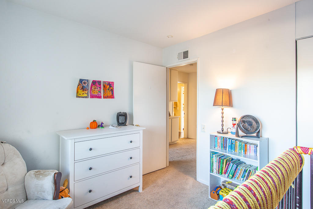 5149 Perkins Road Oxnard, CA 93033 - Photo 32 of 40 a room with furniture a couch and a book shelf