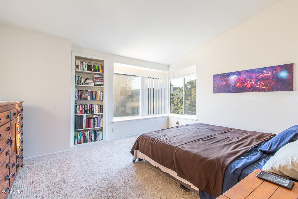 5149 Perkins Road Oxnard, CA 93033 - Photo 33 of 40 a bedroom with a bed and a large window