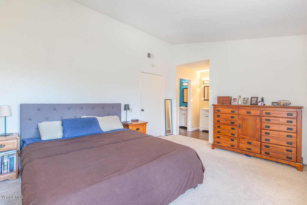 5149 Perkins Road Oxnard, CA 93033 - Photo 34 of 40 a bedroom with a bed and dresser