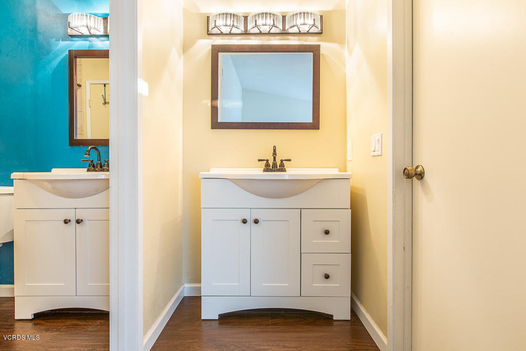 5149 Perkins Road Oxnard, CA 93033 - Photo 36 of 40 a view of bathroom with a sink mirror and tub