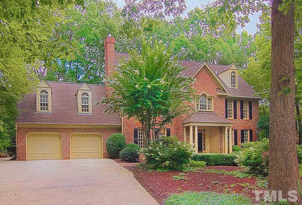 7612 Rainwater Road Raleigh, NC 27615 - Photo 2 of 22 a front view of a house with a yard and trees