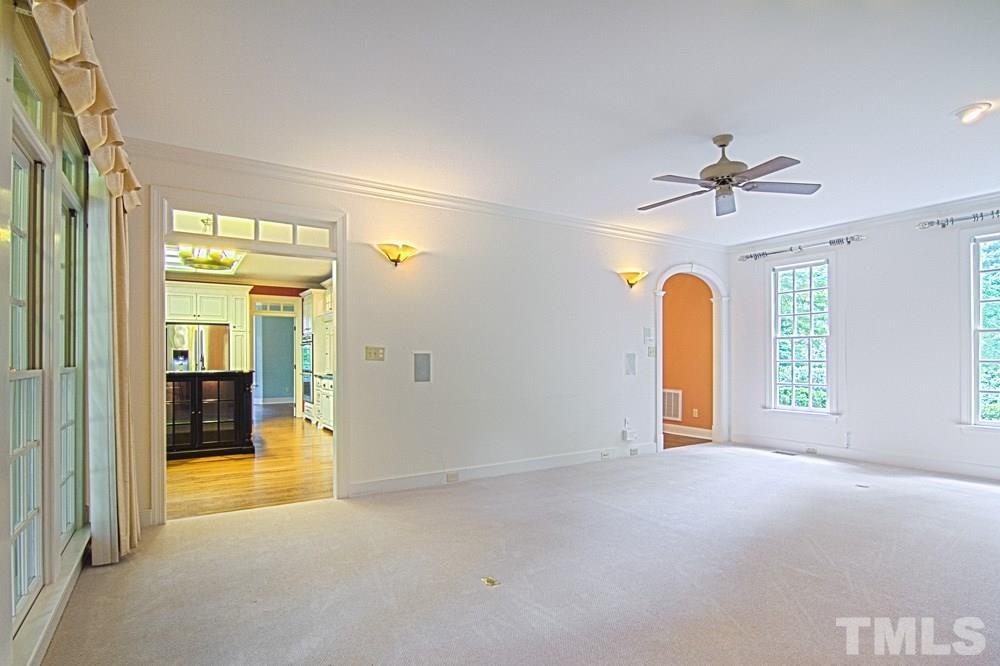 7612 Rainwater Road Raleigh, NC 27615 - Photo 12 of 22 a view of an empty room with a fireplace