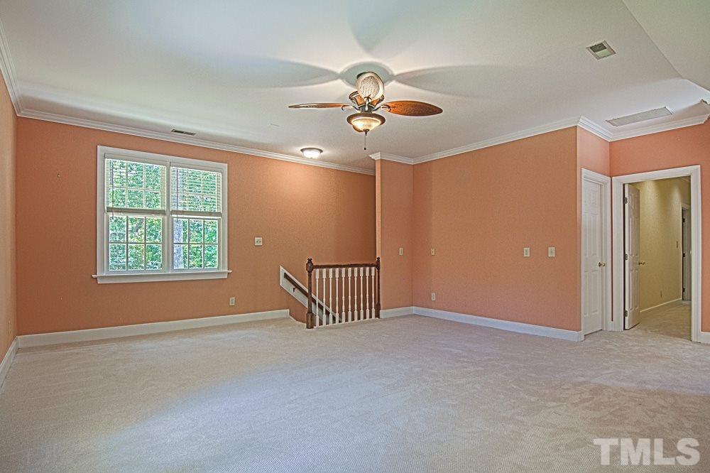 7612 Rainwater Road Raleigh, NC 27615 - Photo 16 of 22 an empty room with windows and fan