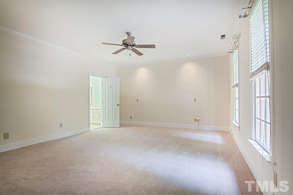 7612 Rainwater Road Raleigh, NC 27615 - Photo 17 of 22 a view of empty room with windows
