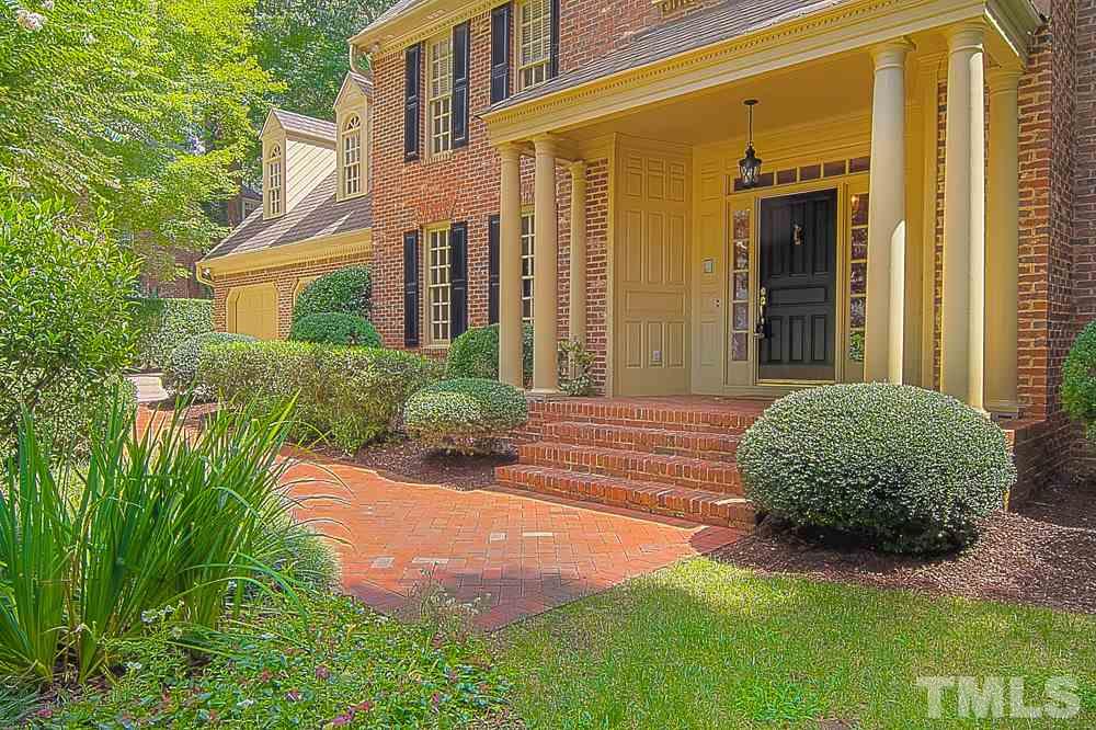 7612 Rainwater Road Raleigh, NC 27615 - Photo 3 of 22 a front view of a house with garden