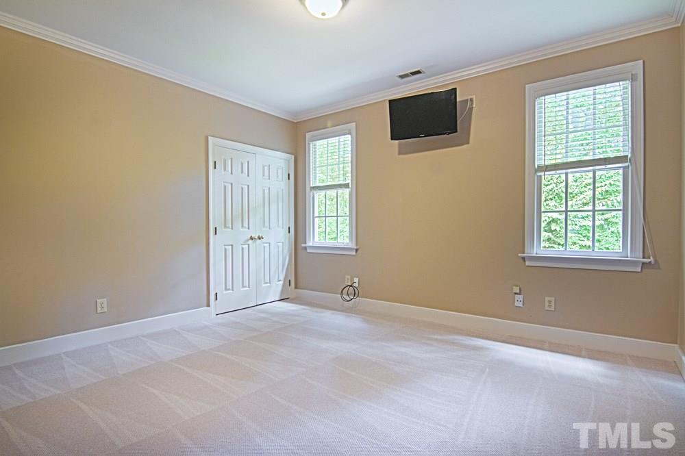 7612 Rainwater Road Raleigh, NC 27615 - Photo 21 of 22 an empty room with windows