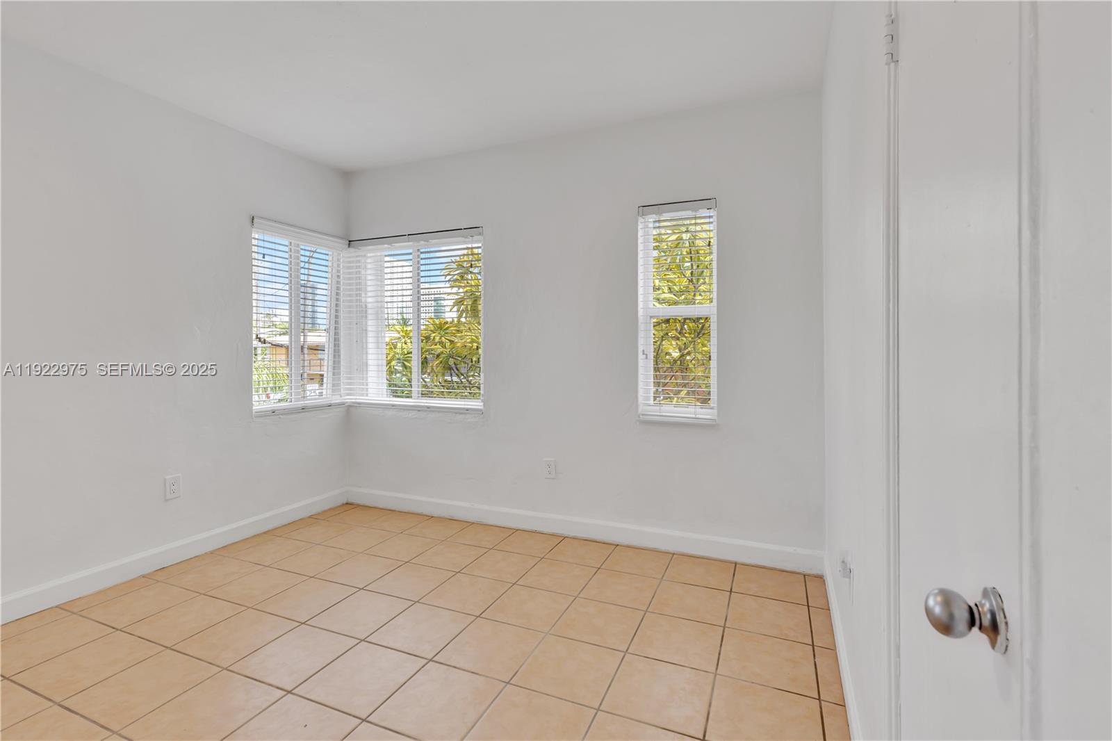 505 Southwest 11th Street, Unit 505 Miami, FL 33129 - Photo 16 of 31 a view of an empty room with window