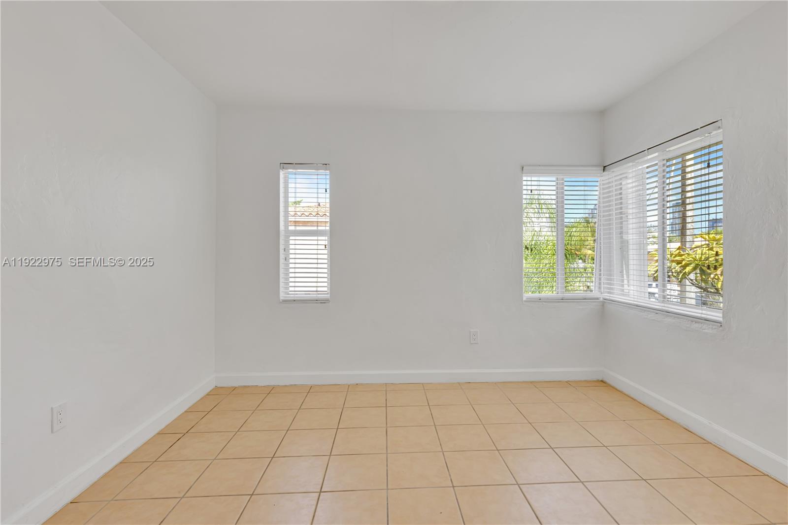 505 Southwest 11th Street, Unit 505 Miami, FL 33129 - Photo 17 of 31 an empty room with windows