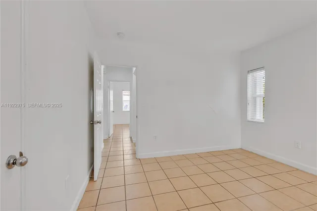 a view of an empty room and window