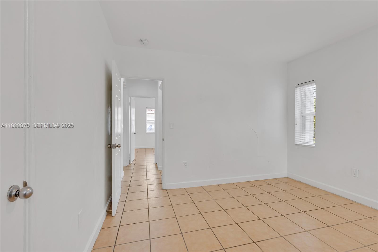 505 Southwest 11th Street, Unit 505 Miami, FL 33129 - Photo 20 of 31 a view of an empty room and window