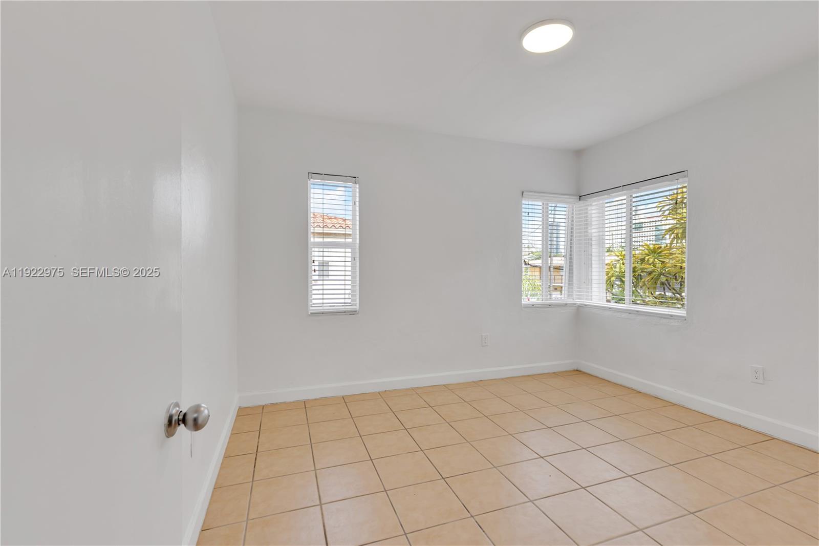 505 Southwest 11th Street, Unit 505 Miami, FL 33129 - Photo 21 of 31 a view of an empty room and window