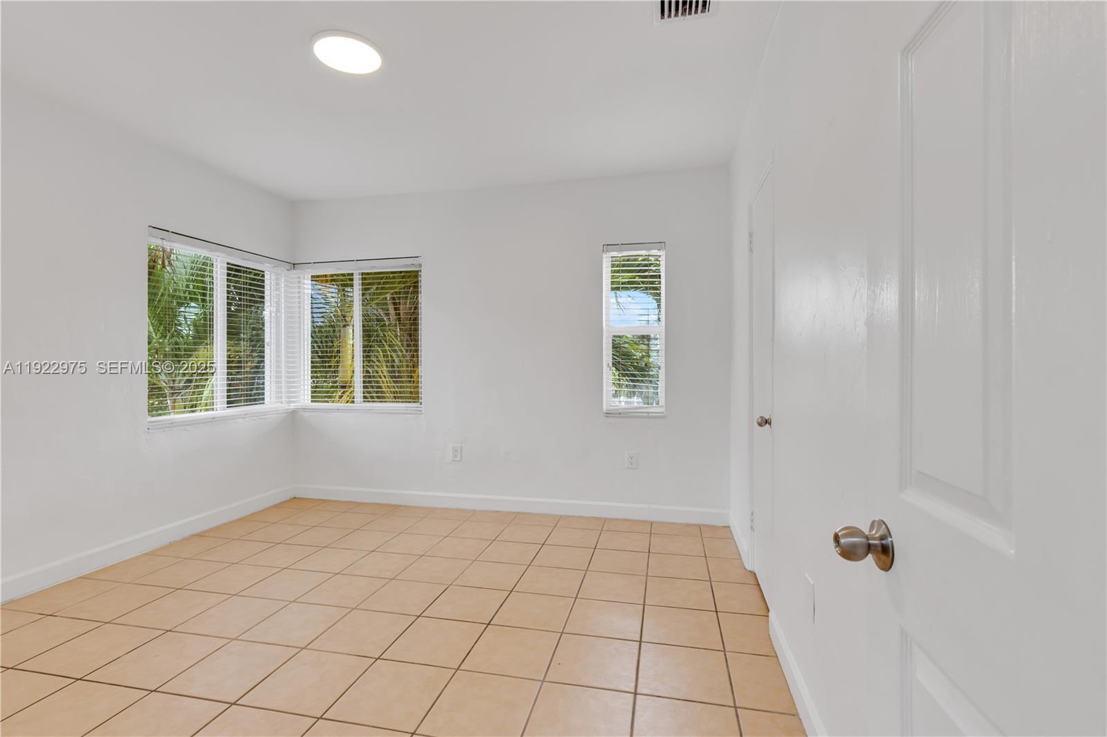 505 Southwest 11th Street, Unit 505 Miami, FL 33129 - Photo 23 of 31 a view of an empty room and window