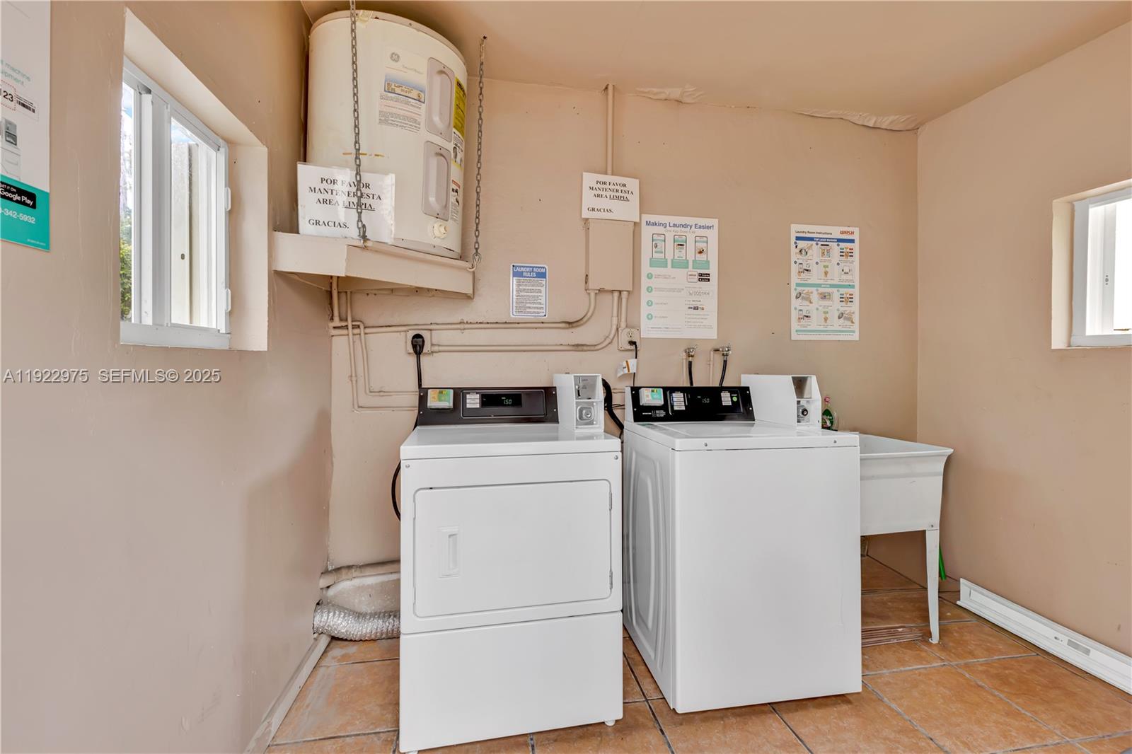 505 Southwest 11th Street, Unit 505 Miami, FL 33129 - Photo 26 of 31 a utility room with closet dryer and washer