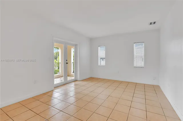a view of an empty room and window