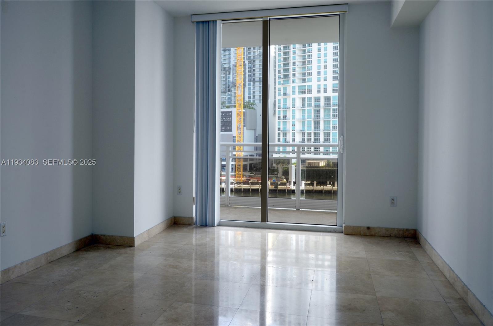 901 Brickell Key Boulevard, Unit 705 Miami, FL 33131 - Photo 19 of 41 a view of a room with window