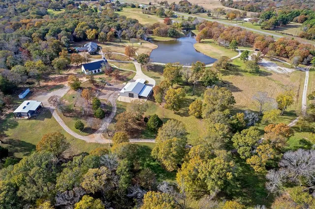 an aerial view of residential houses with outdoor space