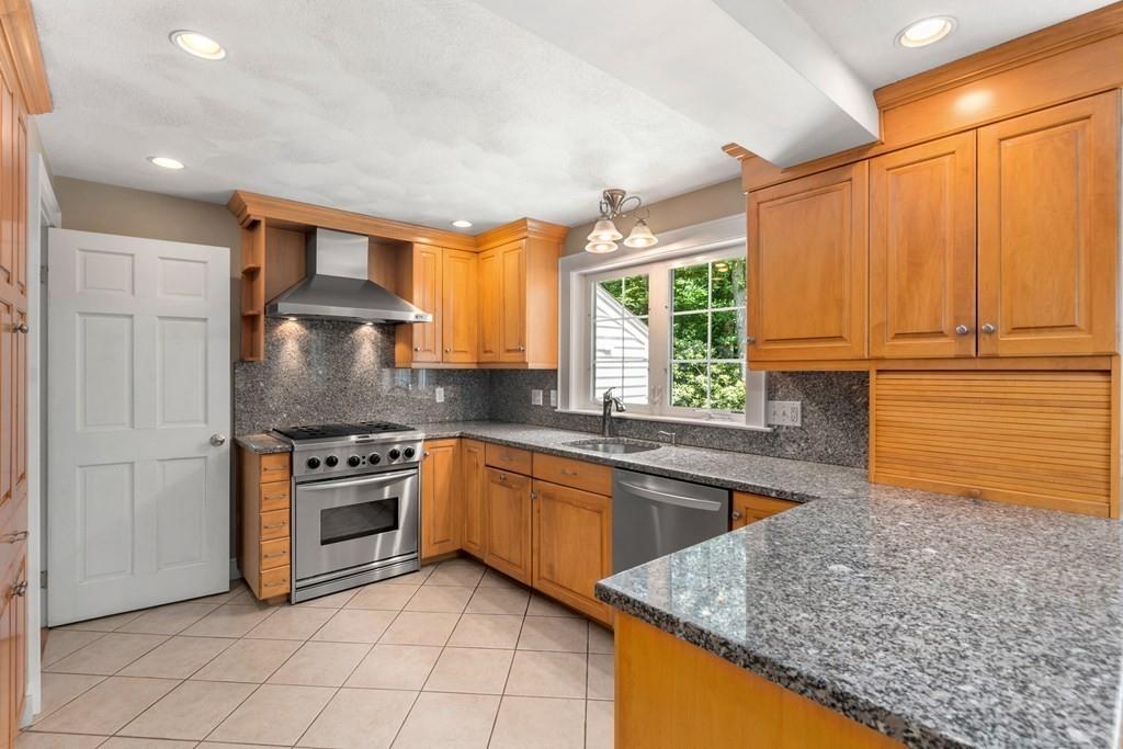 35 Longmeadow Road Belmont, MA 02478 - Photo 7 of 26 a kitchen with stainless steel appliances granite countertop a stove a sink and a microwave