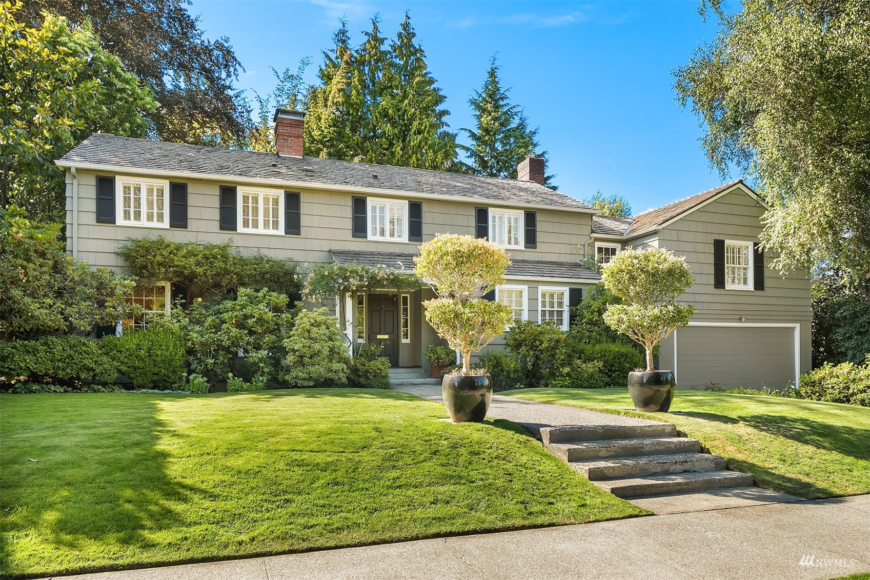 6560 Northeast Windermere Road Seattle, WA 98105 - Photo 1 of 35 a front view of a house with a yard