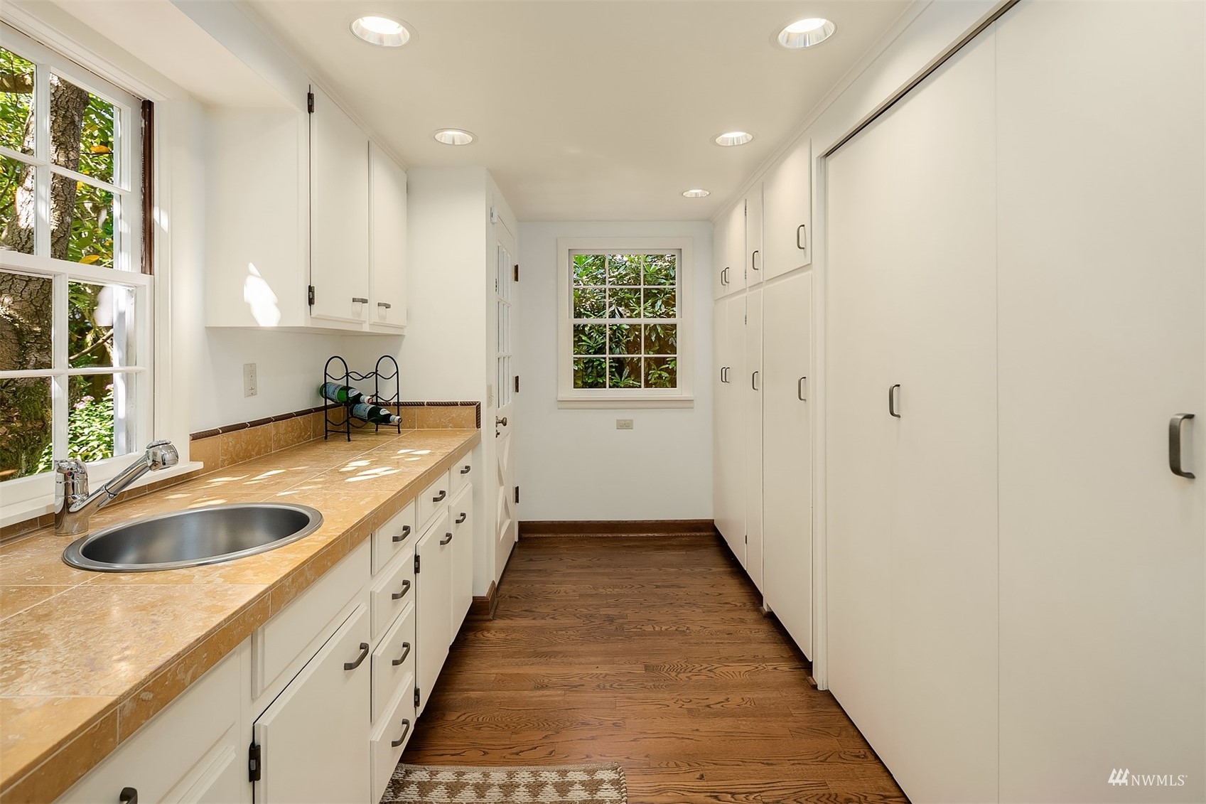 6560 Northeast Windermere Road Seattle, WA 98105 - Photo 11 of 35 a large kitchen with a sink and dishwasher next to a window