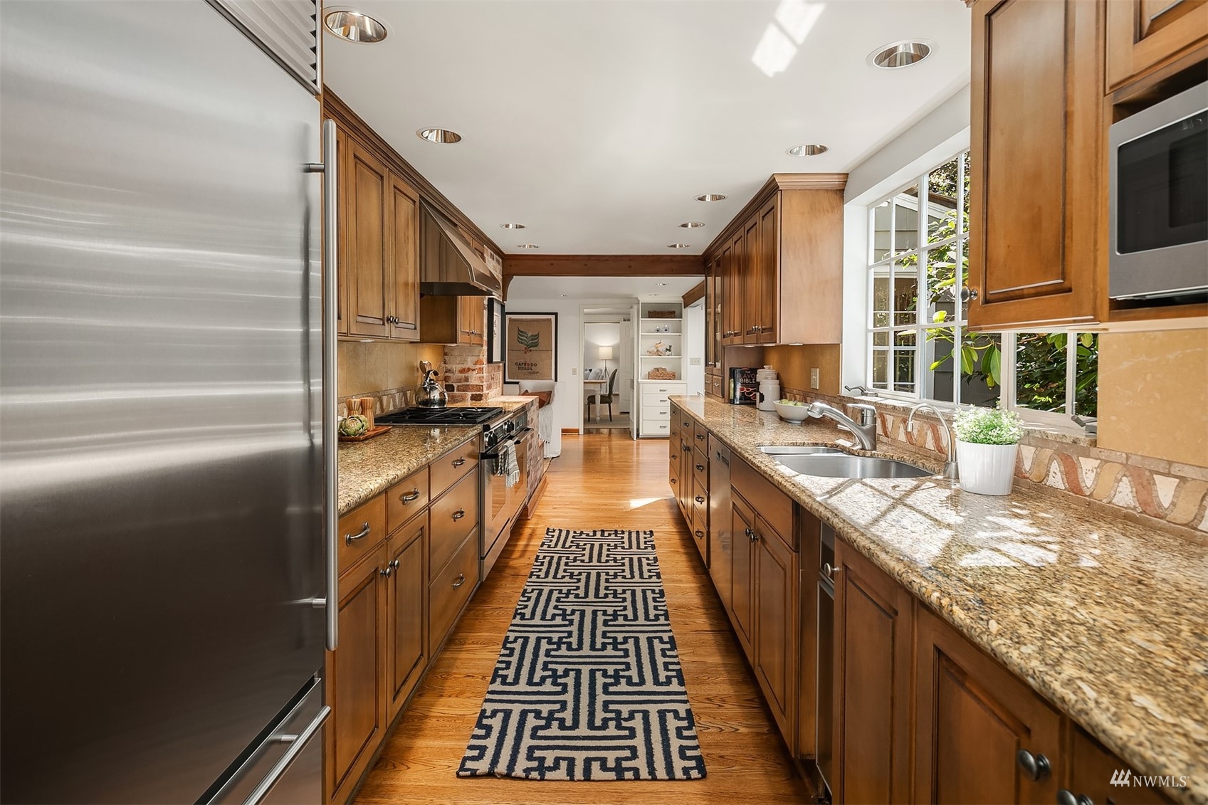 6560 Northeast Windermere Road Seattle, WA 98105 - Photo 12 of 35 a kitchen with stainless steel appliances granite countertop lots of counter top space
