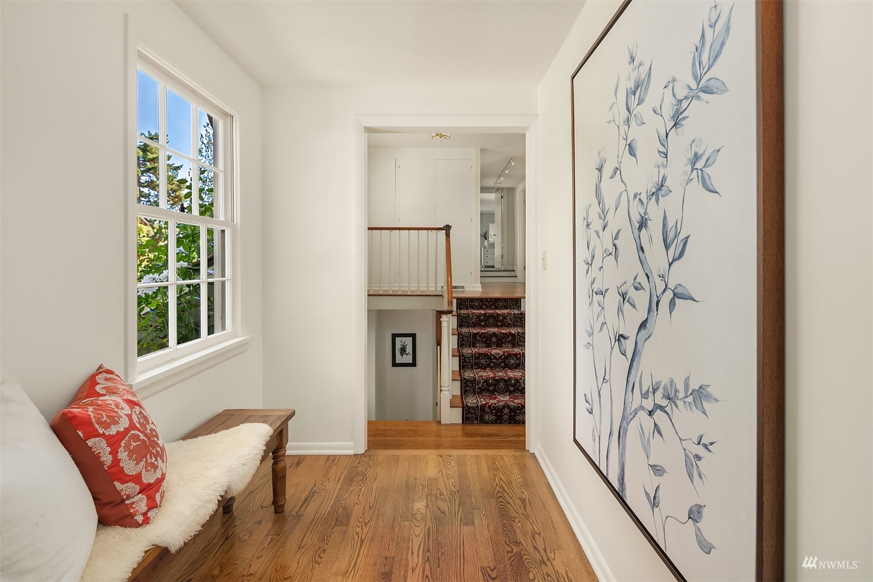 6560 Northeast Windermere Road Seattle, WA 98105 - Photo 14 of 35 a view of a hallway with wooden floor and a bathroom