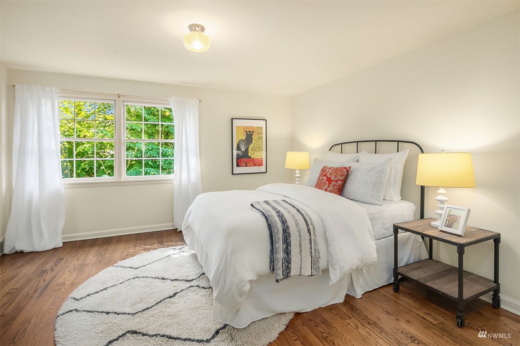 6560 Northeast Windermere Road Seattle, WA 98105 - Photo 20 of 35 a spacious bedroom with a bed and a window