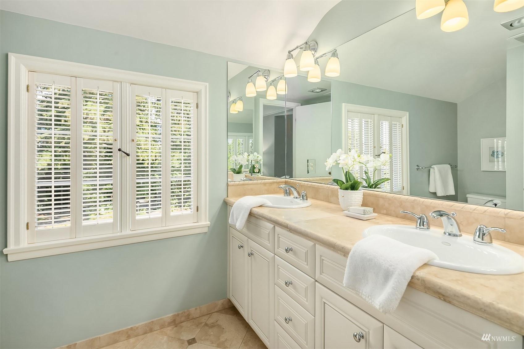 6560 Northeast Windermere Road Seattle, WA 98105 - Photo 24 of 35 a spacious bathroom with double vanity and a mirror