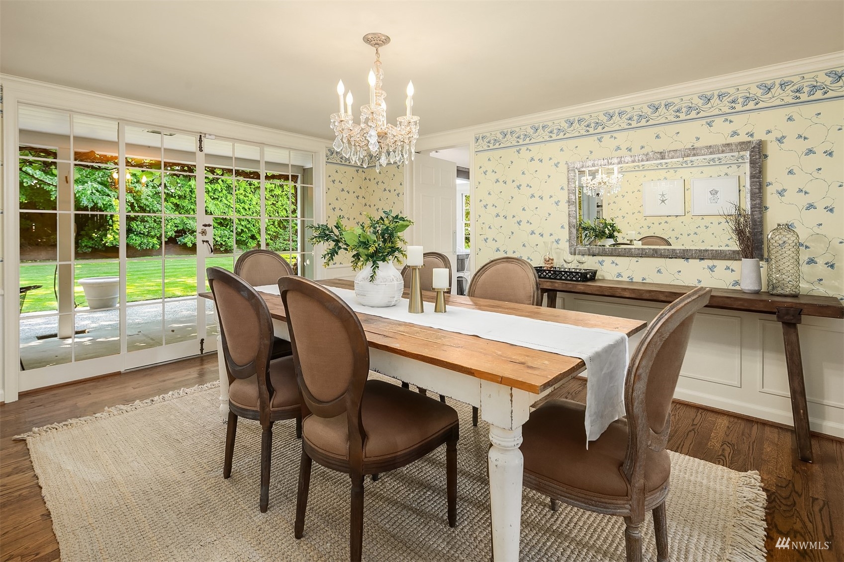 6560 Northeast Windermere Road Seattle, WA 98105 - Photo 5 of 35 a dining room with furniture a chandelier and wooden floor