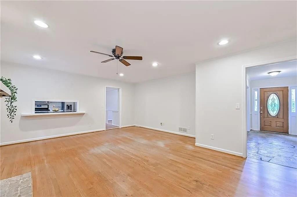 260 River Valley Road Northwest Atlanta, GA 30328 - Photo 7 of 20 a view of an empty room with a ceiling fan
