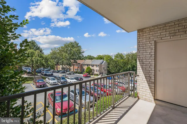 a view of a balcony with wooden stairs